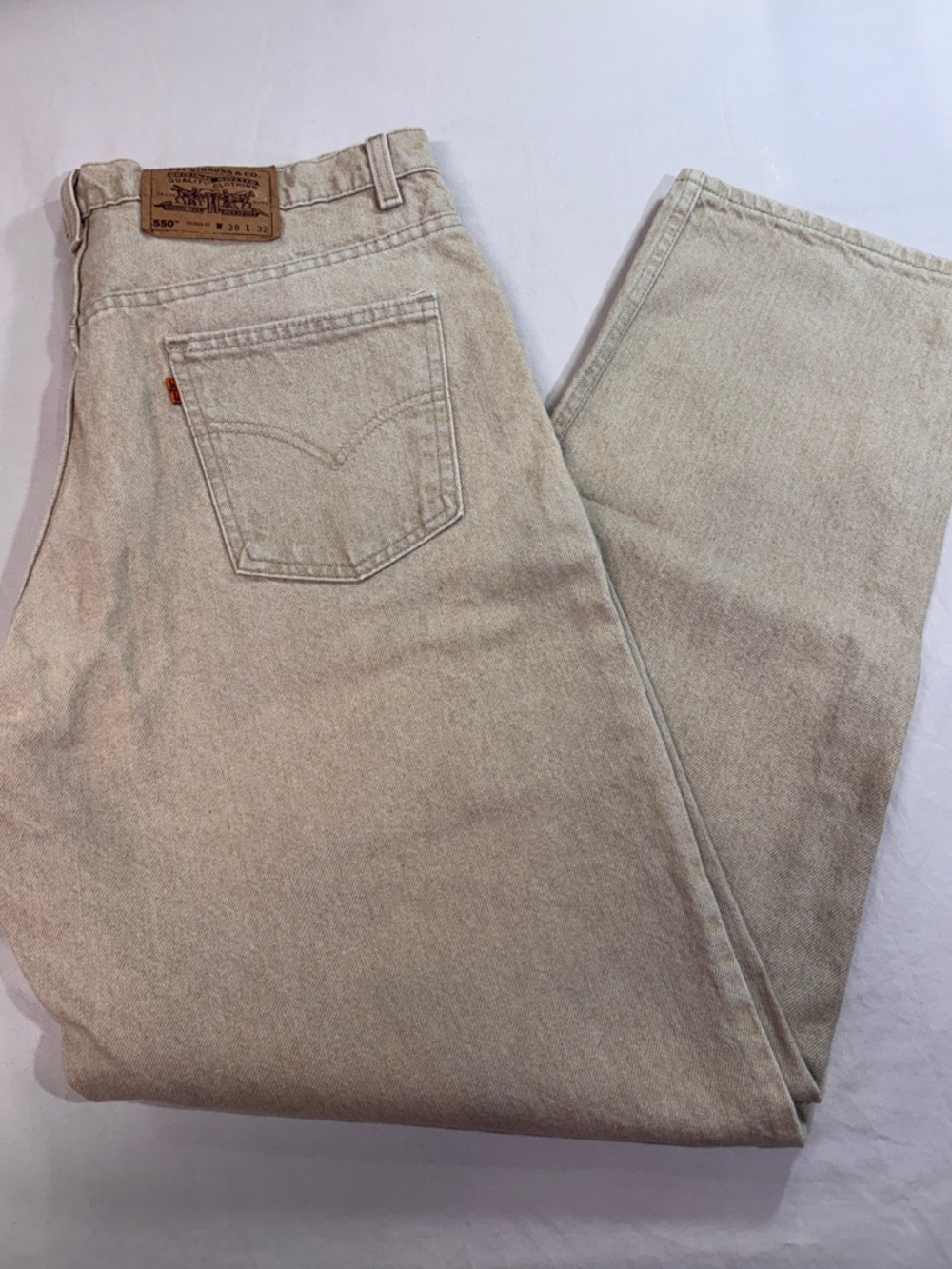 vintage Levi's 550 orange tab jeans tan color relaxed fit 38